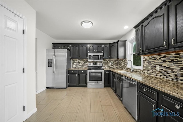 7060 Joannes Way, Maumee, OH 43537 - kitchen featuring stainless steel appliances, a sink, backsplash, and stone counters