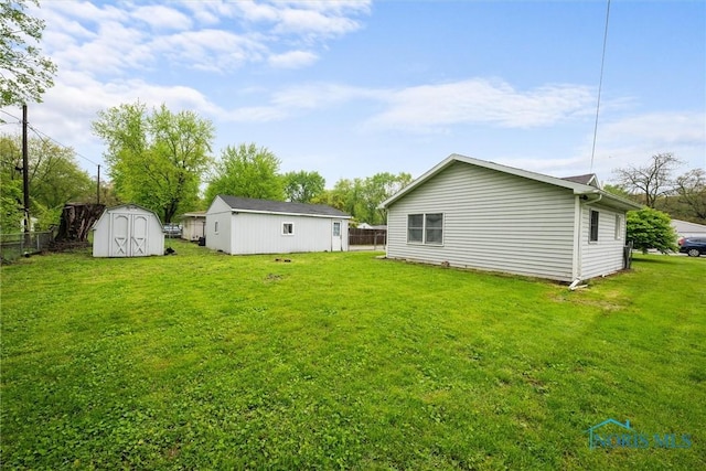 view of yard featuring a storage unit and an outdoor structure