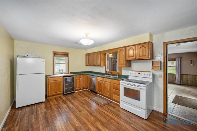 kitchen with white appliances, wine cooler, a sink, and dark wood-style floors