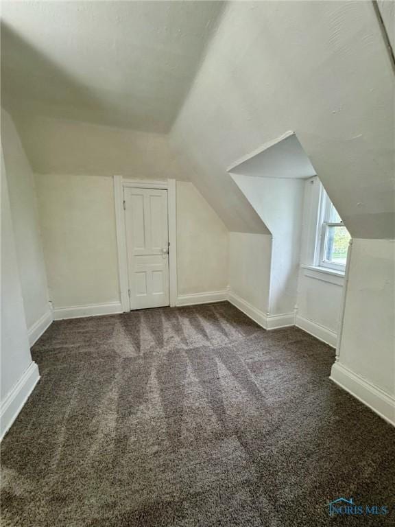 2108 N Michigan St, Toledo, OH 43611 - bonus room featuring carpet, lofted ceiling, and baseboards
