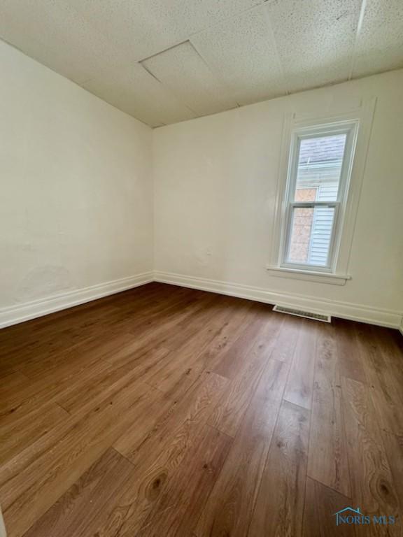 2108 N Michigan St, Toledo, OH 43611 - unfurnished room featuring dark wood-style floors and baseboards