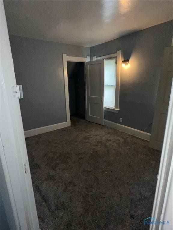 1013 Pinewood Ave, Toledo, OH 43607 - unfurnished bedroom with carpet floors and baseboards