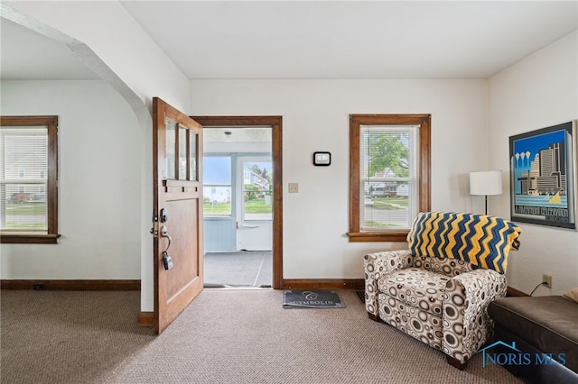 2352 108th St, Toledo, OH 43611 - sitting room with carpet floors, plenty of natural light, and arched walkways