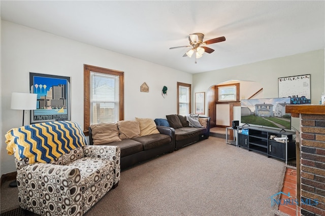 2352 108th St, Toledo, OH 43611 - living room with carpet floors, ceiling fan, and arched walkways