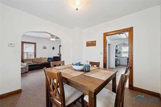 2352 108th St, Toledo, OH 43611 - dining area with arched walkways, healthy amount of natural light, a ceiling fan, and carpet