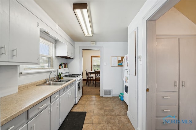 2352 108th St, Toledo, OH 43611 - kitchen featuring white appliances, light countertops, and light tile patterned flooring