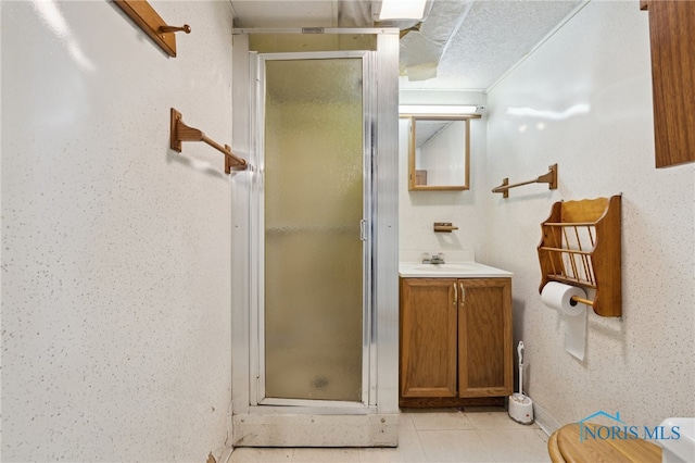 2352 108th St, Toledo, OH 43611 - full bath featuring a stall shower, vanity, and tile patterned flooring