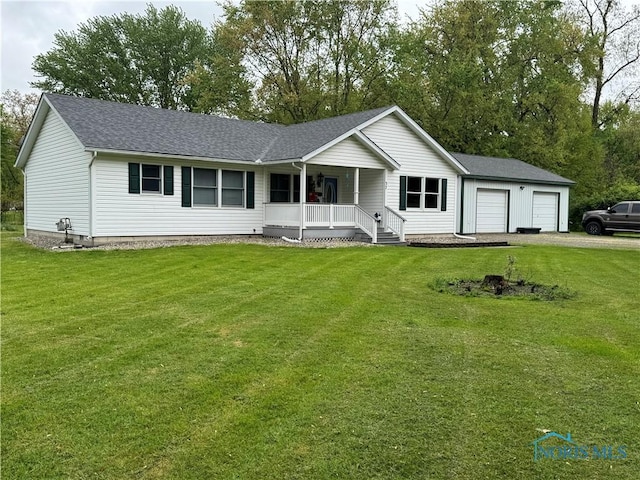 single story home with covered porch, an attached garage, driveway, and a front yard