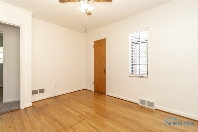 unfurnished room with light wood-style flooring, ceiling fan, and baseboards