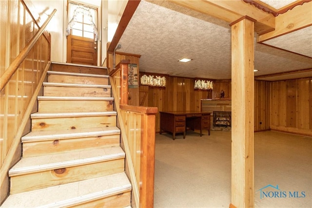 stairs with wood walls