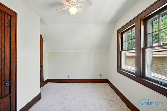 bonus room with carpet, baseboards, ceiling fan, and lofted ceiling