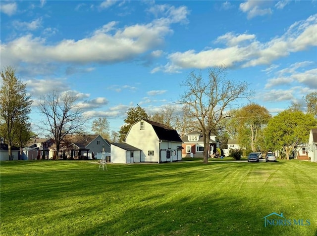 5907 N Berkey Southern Rd, Berkey, OH 43504 - view of green lawn featuring a barn, a residential view, and an outdoor structure