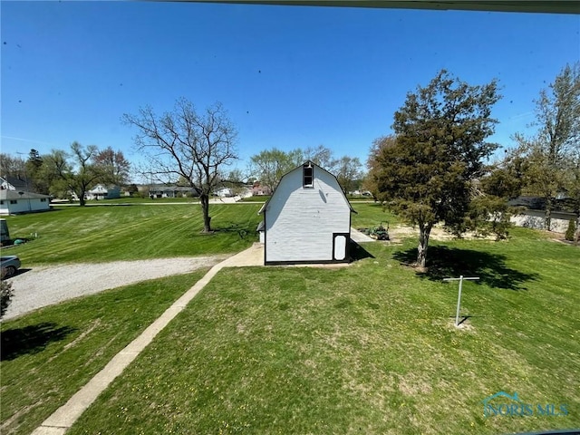 5907 N Berkey Southern Rd, Berkey, OH 43504 - view of grassy yard featuring a barn and an outbuilding