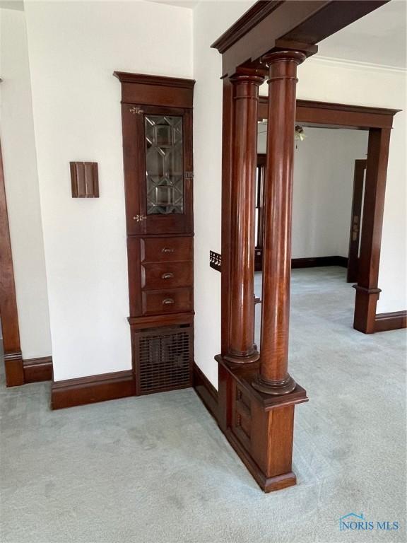 5907 N Berkey Southern Rd, Berkey, OH 43504 - corridor with light carpet, baseboards, and decorative columns