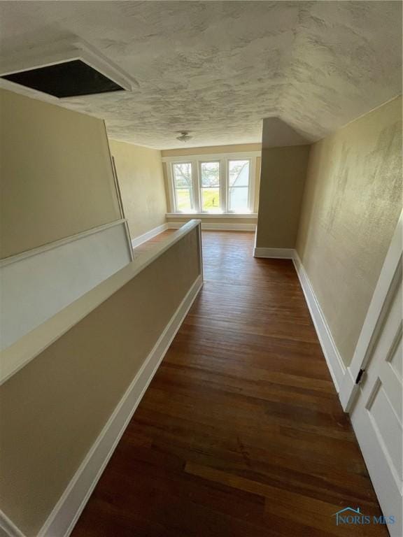 5907 N Berkey Southern Rd, Berkey, OH 43504 - corridor with dark wood-style flooring, baseboards, and a textured ceiling