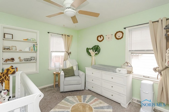 3134 Cragmoor Ave, Toledo, OH 43614 - bedroom with a nursery area, light carpet, baseboards, and ceiling fan