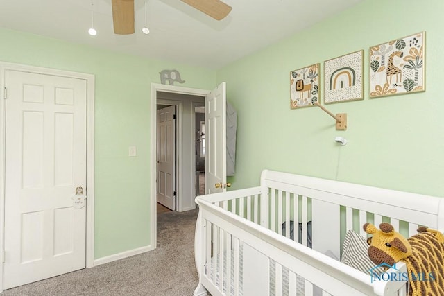 3134 Cragmoor Ave, Toledo, OH 43614 - carpeted bedroom with baseboards, a ceiling fan, and a nursery area