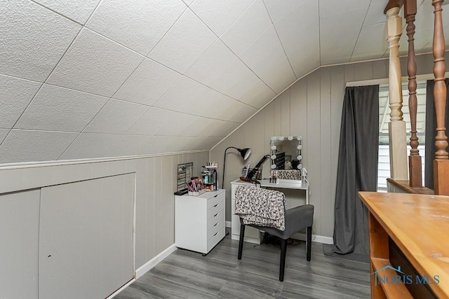 3134 Cragmoor Ave, Toledo, OH 43614 - additional living space with lofted ceiling, wood finished floors, a decorative wall, and baseboards
