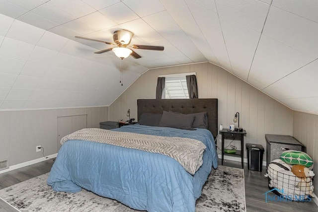 3134 Cragmoor Ave, Toledo, OH 43614 - bedroom with wood finished floors, lofted ceiling, ceiling fan, wood walls, and baseboards