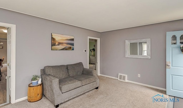 3134 Cragmoor Ave, Toledo, OH 43614 - living room with baseboards and carpet