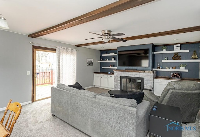 3134 Cragmoor Ave, Toledo, OH 43614 - living room with baseboards, a ceiling fan, light carpet, a fireplace, and beam ceiling