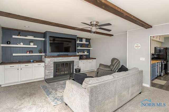 3134 Cragmoor Ave, Toledo, OH 43614 - living room with a ceiling fan, beamed ceiling, carpet flooring, and a glass covered fireplace