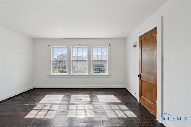 1908 Parkdale Ave, Toledo, OH 43607 - empty room with wood finished floors and baseboards