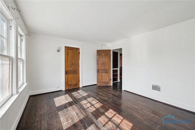 1908 Parkdale Ave, Toledo, OH 43607 - spare room featuring hardwood / wood-style floors and baseboards