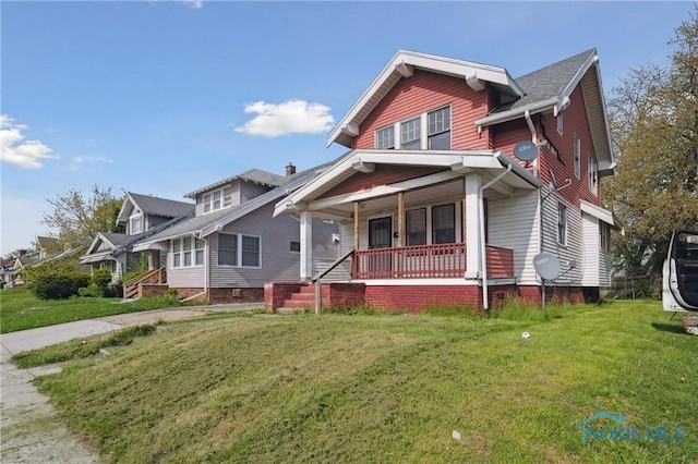 1908 Parkdale Ave, Toledo, OH 43607 - view of front facade with covered porch and a front lawn