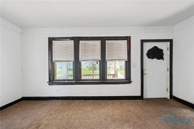 1908 Parkdale Ave, Toledo, OH 43607 - carpeted empty room with baseboards