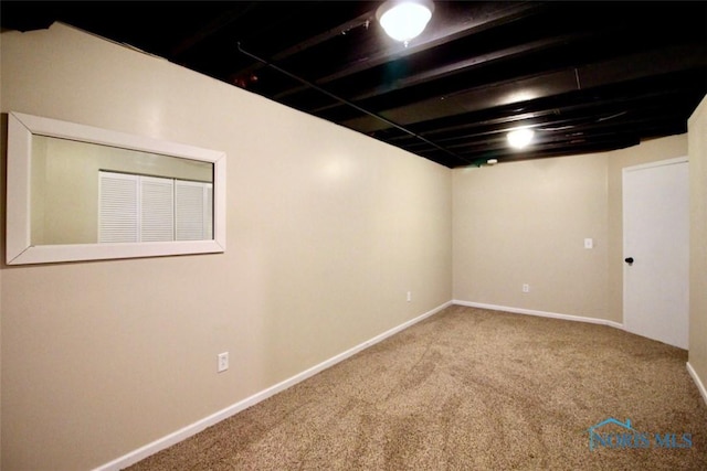 finished basement with carpet floors and baseboards
