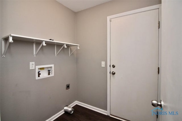laundry room featuring electric dryer hookup, washer hookup, baseboards, and dark wood finished floors
