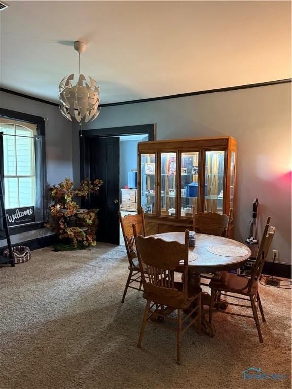 318 S Main St, North Baltimore, OH 45872 - dining space featuring a chandelier, carpet, and ornamental molding