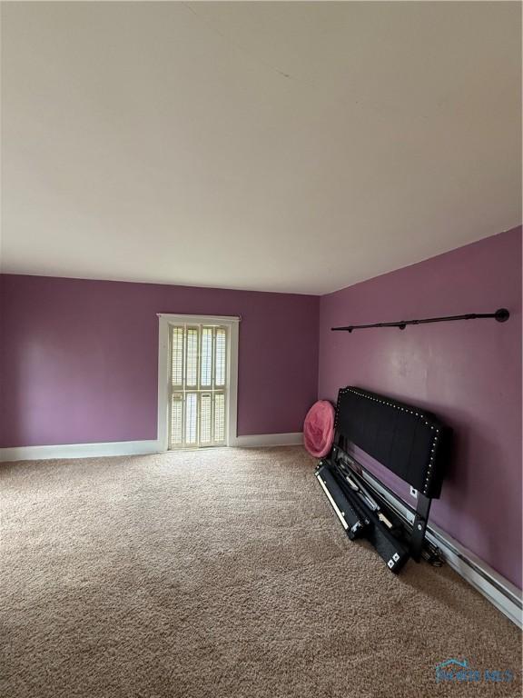 318 S Main St, North Baltimore, OH 45872 - living area with carpet and baseboards