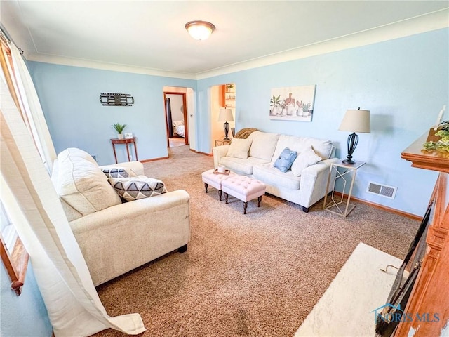 624 Myers St, Toledo, OH 43609 - carpeted living room featuring baseboards and ornamental molding