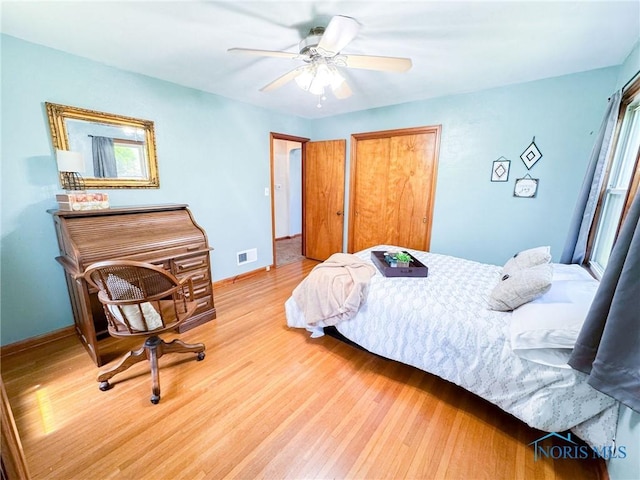 624 Myers St, Toledo, OH 43609 - bedroom featuring wood finished floors, baseboards, and a ceiling fan