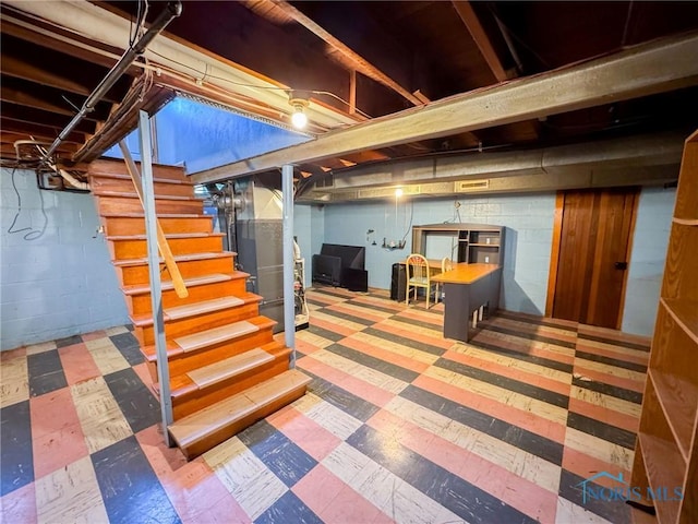 624 Myers St, Toledo, OH 43609 - unfinished below grade area with tile patterned floors, stairs, and heating unit