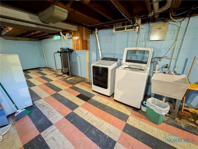 624 Myers St, Toledo, OH 43609 - clothes washing area with tile patterned floors and separate washer and dryer