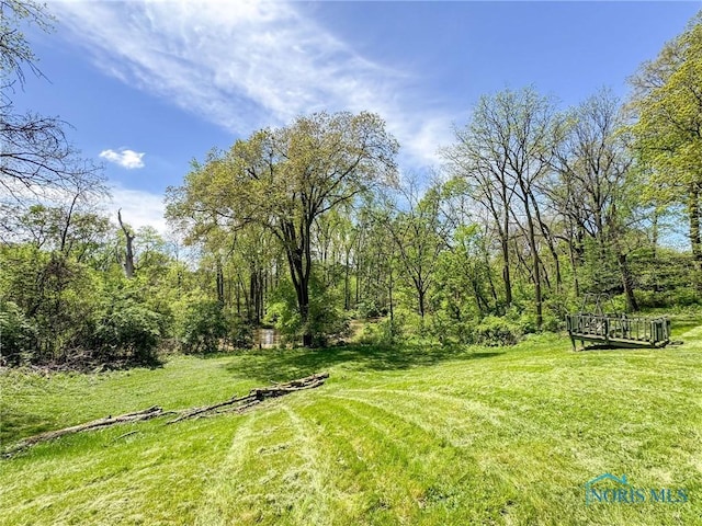 624 Myers St, Toledo, OH 43609 - view of green lawn with a wooden deck