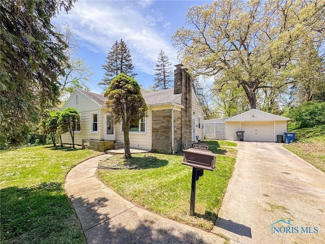 624 Myers St, Toledo, OH 43609 - view of front of home featuring a garage, a front lawn, a chimney, and stone siding