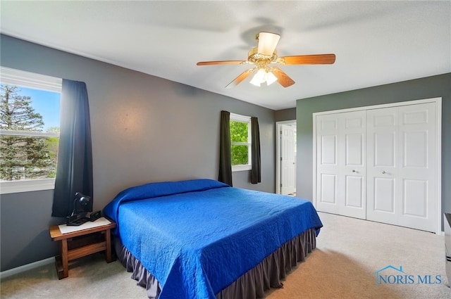 5532 Bentwood Dr, Toledo, OH 43615 - carpeted bedroom featuring a closet, ceiling fan, and baseboards