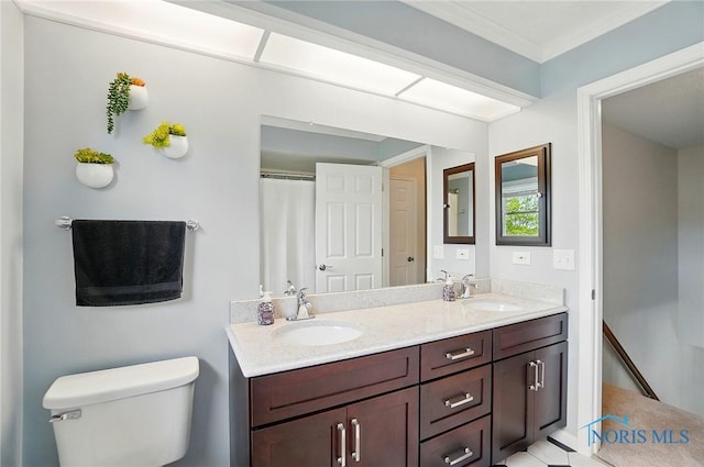 5532 Bentwood Dr, Toledo, OH 43615 - bathroom with toilet, double vanity, and crown molding