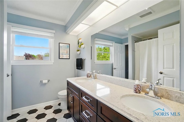 5532 Bentwood Dr, Toledo, OH 43615 - full bathroom with toilet, baseboards, ornamental molding, double vanity, and tile patterned floors