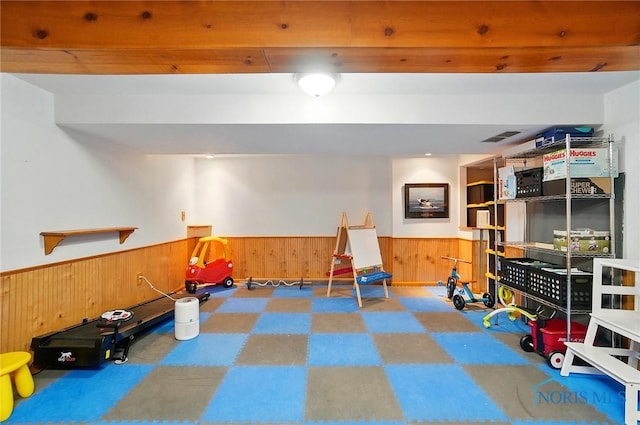 5532 Bentwood Dr, Toledo, OH 43615 - game room with wooden walls, a wainscoted wall, and tile patterned floors