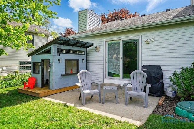 5532 Bentwood Dr, Toledo, OH 43615 - rear view of house with a chimney, a yard, and a patio area