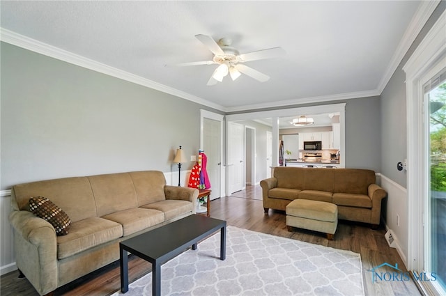 5532 Bentwood Dr, Toledo, OH 43615 - living room featuring wood finished floors, a ceiling fan, and crown molding