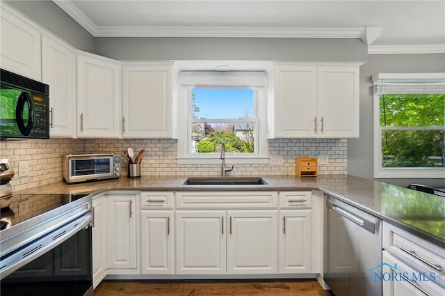 5532 Bentwood Dr, Toledo, OH 43615 - kitchen featuring stainless steel appliances, a sink, white cabinetry, backsplash, and crown molding