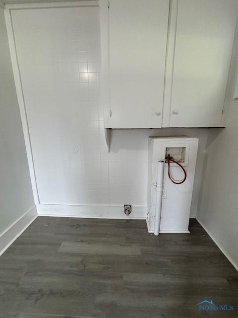 938 Western Ave, Toledo, OH 43609 - washroom with cabinet space, baseboards, hookup for a washing machine, and dark wood-type flooring