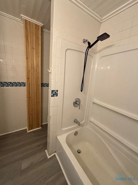 938 Western Ave, Toledo, OH 43609 - full bathroom featuring wood finished floors, bathtub / shower combination, and tile walls