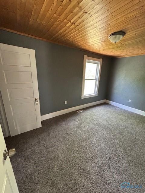 938 Western Ave, Toledo, OH 43609 - carpeted empty room featuring wooden ceiling and baseboards